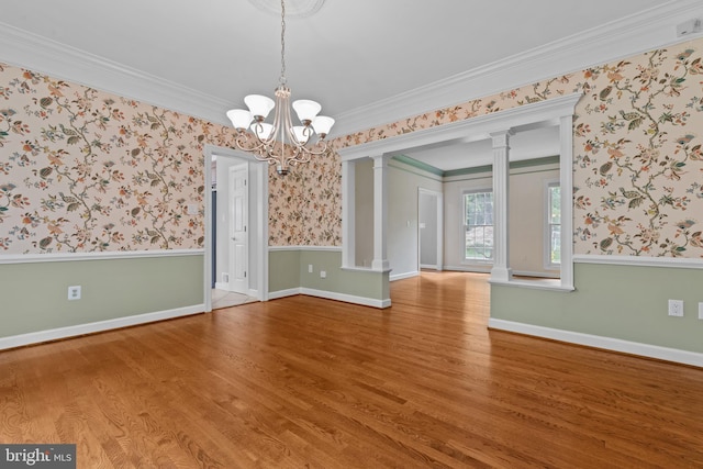 502 Pride Of Baltimore Dr, Arnold, MD 21012 - empty room with ornate columns, wood finished floors, ornamental molding, a chandelier, and wallpapered walls