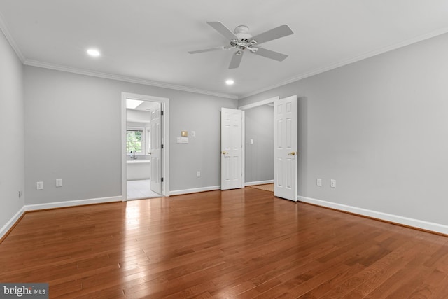 502 Pride Of Baltimore Dr, Arnold, MD 21012 - unfurnished bedroom featuring ornamental molding, wood finished floors, baseboards, recessed lighting, and ensuite bathroom