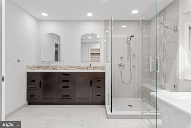 502 Pride Of Baltimore Dr, Arnold, MD 21012 - bathroom with a shower stall, double vanity, a freestanding bath, recessed lighting, and baseboards