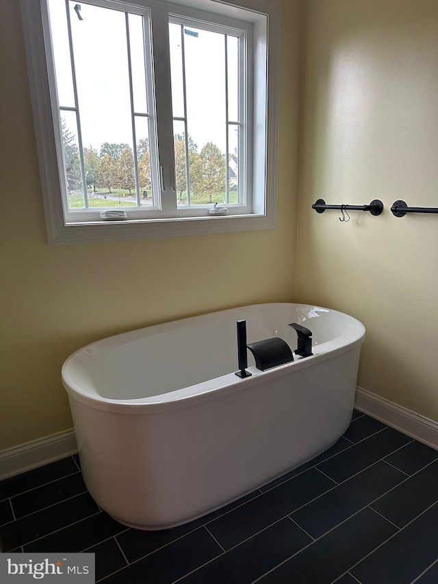 64B Kirk Rd, Garnet Valley, PA 19061 - full bathroom with plenty of natural light, baseboards, and a soaking tub