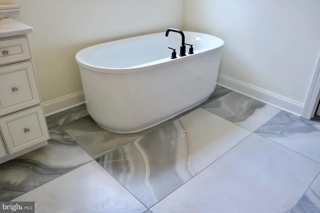 64B Kirk Rd, Garnet Valley, PA 19061 - full bathroom with a freestanding bath, baseboards, vanity, and marble finish flooring