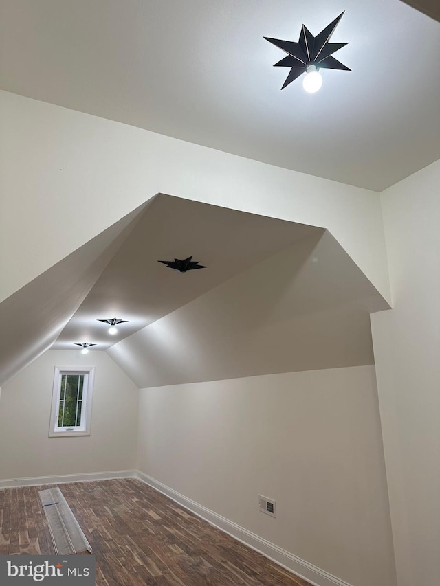 64B Kirk Rd, Garnet Valley, PA 19061 - additional living space with lofted ceiling, wood finished floors, and baseboards