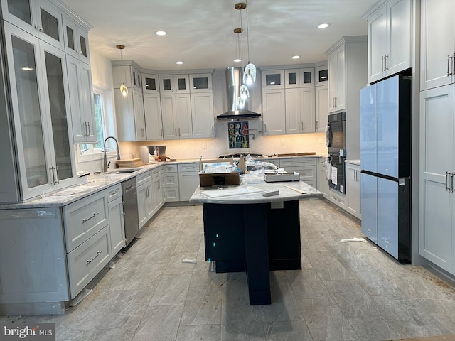 64B Kirk Rd, Garnet Valley, PA 19061 - kitchen with wall chimney range hood, appliances with stainless steel finishes, a sink, a center island, and backsplash