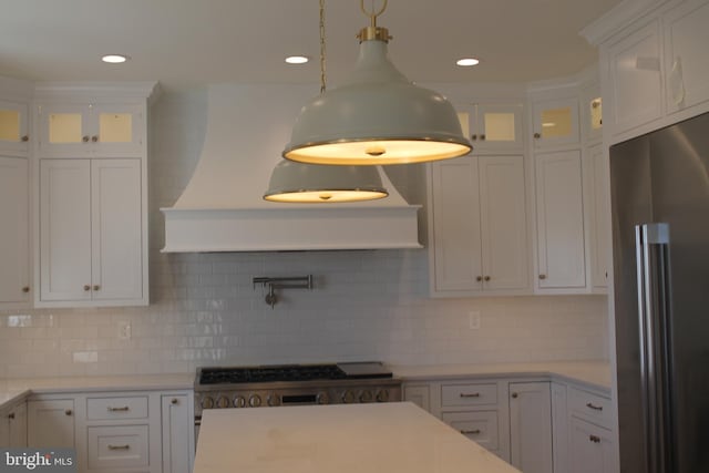 64B Kirk Rd, Garnet Valley, PA 19061 - kitchen with high end fridge, white cabinetry, light countertops, backsplash, and glass insert cabinets