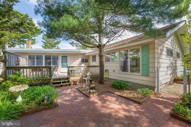 60 Holly, Long Beach Township, NJ 08008 - back of property featuring a wooden deck and a patio area