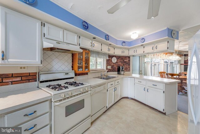 60 Holly, Long Beach Township, NJ 08008 - kitchen with white appliances, under cabinet range hood, a sink, light countertops, and white cabinetry