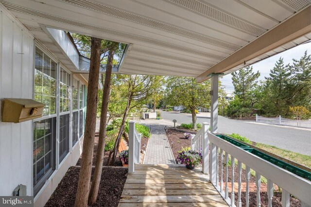 60 Holly, Long Beach Township, NJ 08008 - wooden terrace featuring covered porch