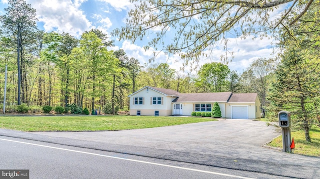 6057 English Creek Ave, Egg Harbor Township, NJ 08234 - split level home featuring driveway, an attached garage, and a front lawn