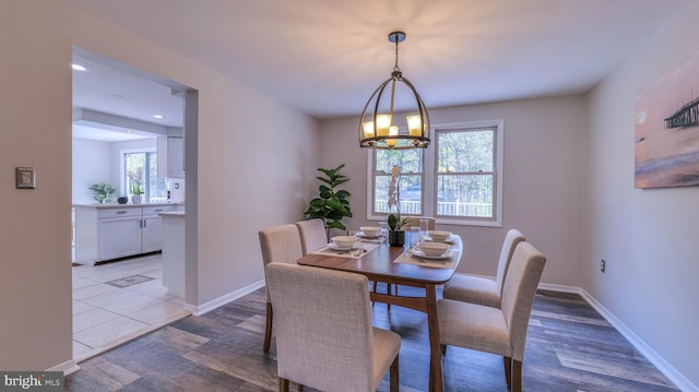 6057 English Creek Ave, Egg Harbor Township, NJ 08234 - dining area featuring a chandelier, baseboards, and light wood finished floors