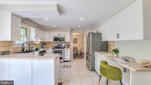 6057 English Creek Ave, Egg Harbor Township, NJ 08234 - kitchen featuring stainless steel appliances, a sink, light countertops, backsplash, and recessed lighting