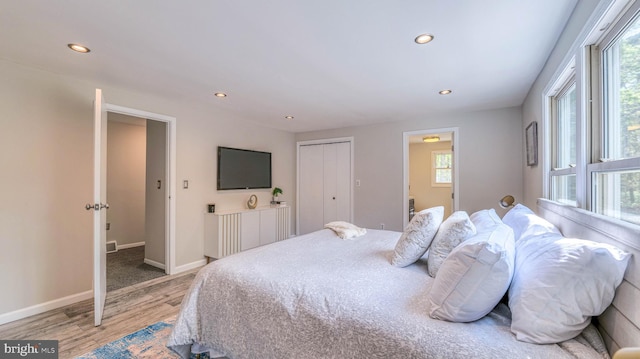 6057 English Creek Ave, Egg Harbor Township, NJ 08234 - bedroom featuring light wood finished floors, multiple windows, recessed lighting, and baseboards