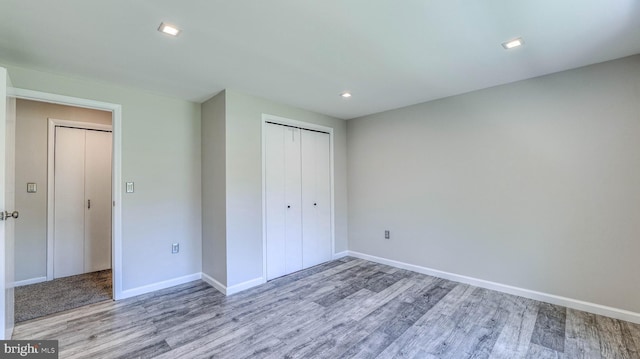 6057 English Creek Ave, Egg Harbor Township, NJ 08234 - unfurnished bedroom with wood finished floors, a closet, baseboards, and recessed lighting