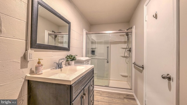 6057 English Creek Ave, Egg Harbor Township, NJ 08234 - bathroom with a shower stall, wood finished floors, and vanity