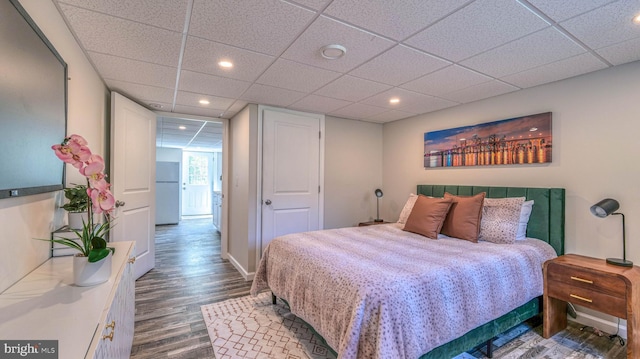 6057 English Creek Ave, Egg Harbor Township, NJ 08234 - bedroom featuring freestanding refrigerator, wood finished floors, recessed lighting, and a paneled ceiling