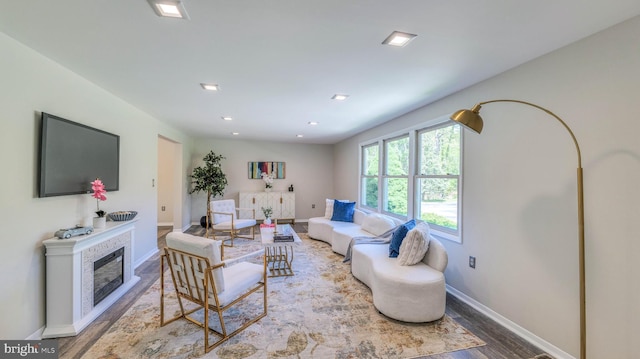 6057 English Creek Ave, Egg Harbor Township, NJ 08234 - living area featuring wood finished floors, baseboards, a glass covered fireplace, and recessed lighting