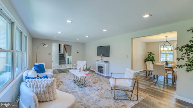 6057 English Creek Ave, Egg Harbor Township, NJ 08234 - living area with wood finished floors, stairway, baseboards, recessed lighting, and a glass covered fireplace