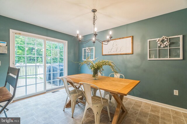 134 Whitaker Ave, North East, MD 21901 - dining area featuring a chandelier and baseboards