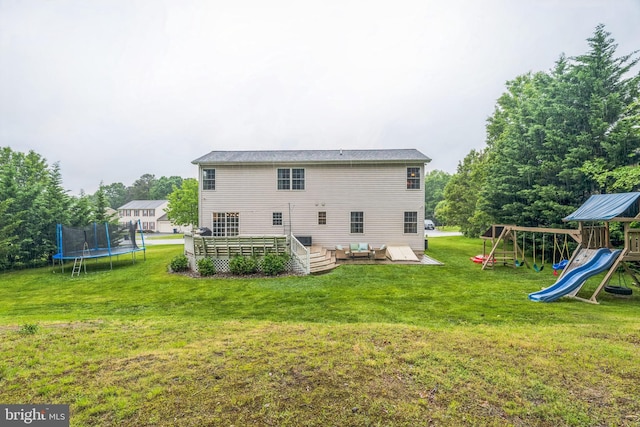 134 Whitaker Ave, North East, MD 21901 - back of house with a trampoline, a yard, a playground, and a wooden deck