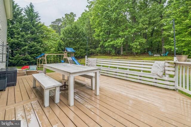 134 Whitaker Ave, North East, MD 21901 - wooden deck with a playground and view of scattered trees