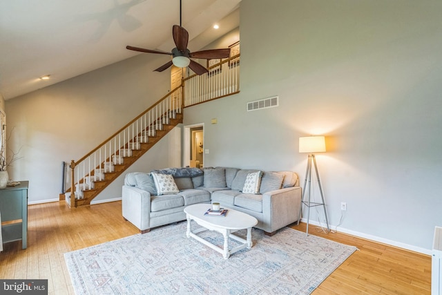 134 Whitaker Ave, North East, MD 21901 - living room with stairs, hardwood / wood-style floors, high vaulted ceiling, baseboards, and a ceiling fan