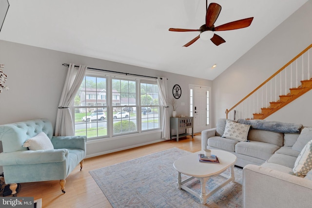 134 Whitaker Ave, North East, MD 21901 - living area with ceiling fan, light wood-style flooring, stairs, high vaulted ceiling, and baseboards
