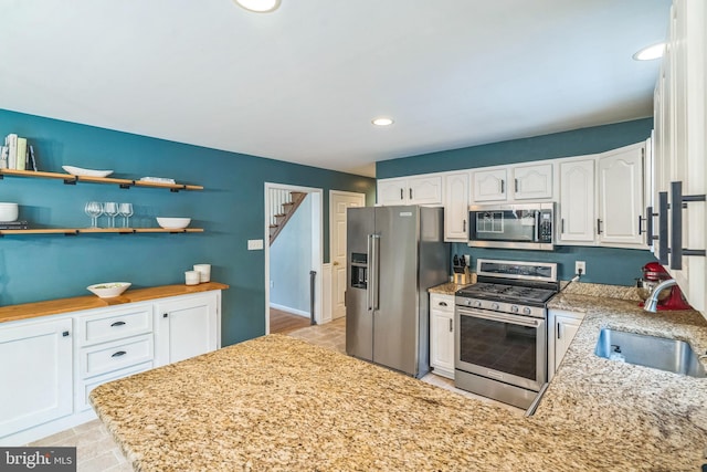 134 Whitaker Ave, North East, MD 21901 - kitchen featuring appliances with stainless steel finishes, a sink, white cabinetry, light stone counters, and recessed lighting