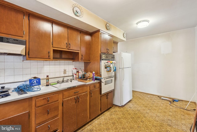 310 Passmore St, Philadelphia, PA 19111 - kitchen with white appliances, range hood, light flooring, and decorative backsplash