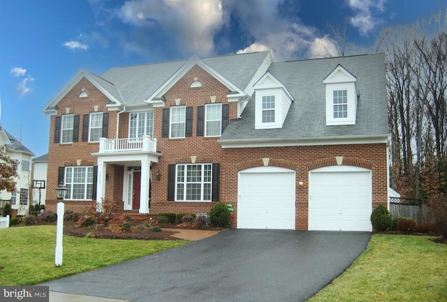 16340 Sandy Ridge Ct, Woodbridge, VA 22191 - georgian-style home with driveway, a front lawn, brick siding, a garage, and a shingled roof