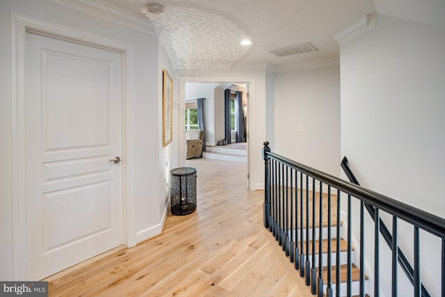 16340 Sandy Ridge Ct, Woodbridge, VA 22191 - hallway with an upstairs landing, crown molding, wood finished floors, baseboards, and recessed lighting