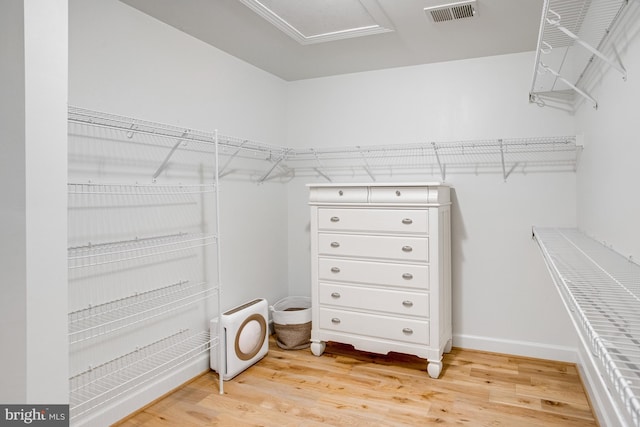 16340 Sandy Ridge Ct, Woodbridge, VA 22191 - spacious closet featuring light wood-type flooring and attic access