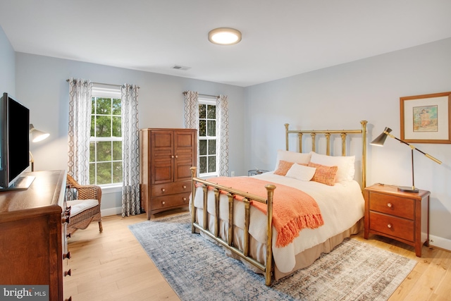 16340 Sandy Ridge Ct, Woodbridge, VA 22191 - bedroom with light wood-style floors and baseboards