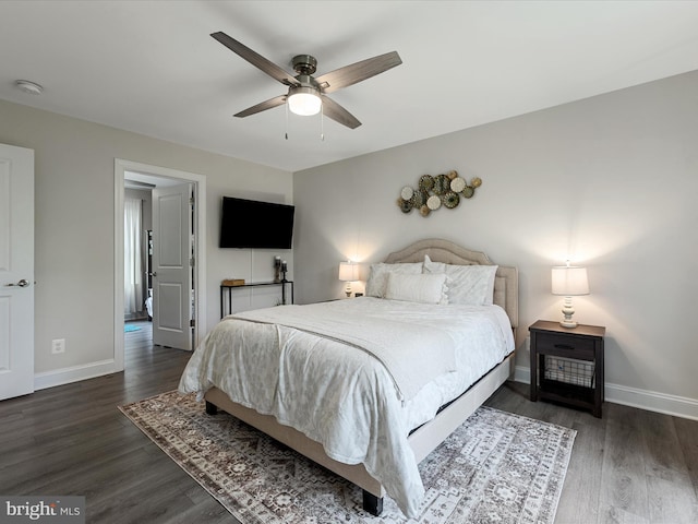 bedroom featuring baseboards and wood finished floors