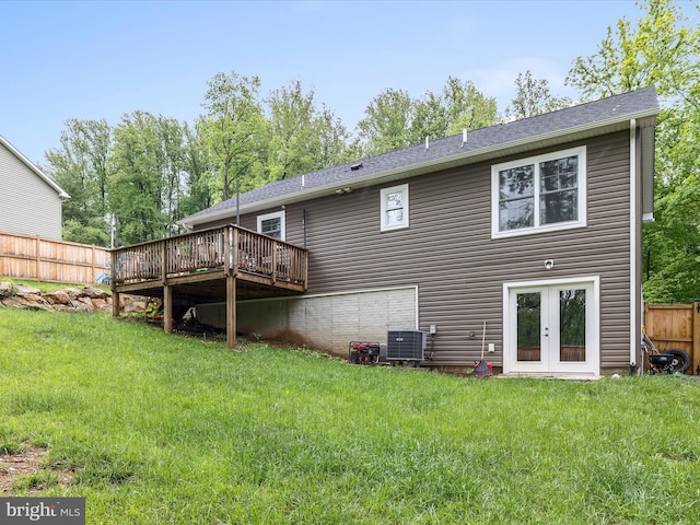 rear view of house featuring a wooden deck, french doors, and central AC