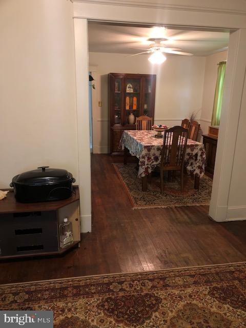 3812 Gwynn Oak Ave, Baltimore, MD 21207 - dining space with wood finished floors and ceiling fan