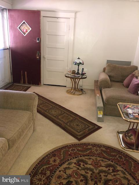 3812 Gwynn Oak Ave, Baltimore, MD 21207 - living area with carpet floors