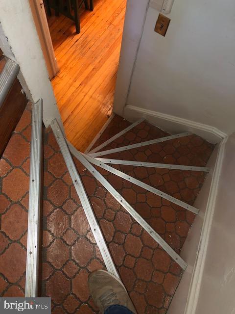 3812 Gwynn Oak Ave, Baltimore, MD 21207 - stairs featuring tile patterned flooring
