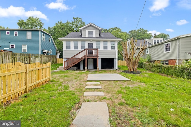 rear view of property featuring a patio and stairs