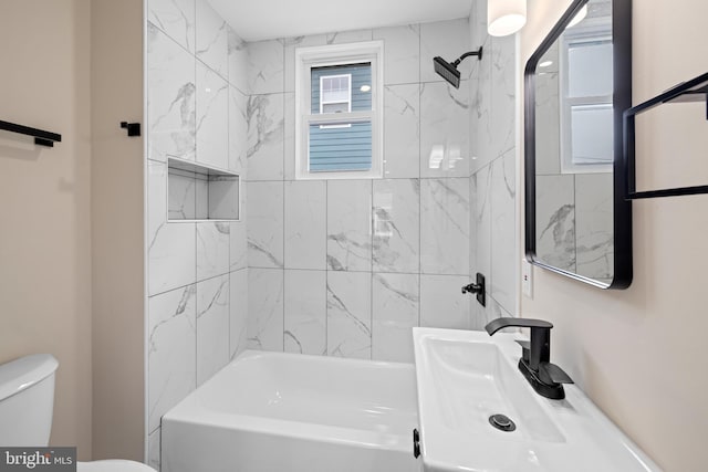 bathroom with toilet, bathing tub / shower combination, and vanity