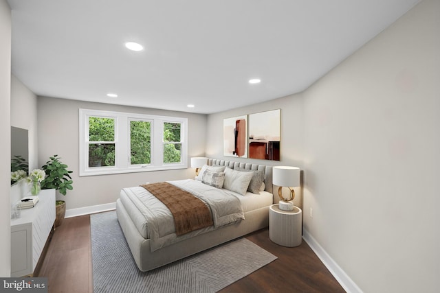 bedroom with baseboards, wood finished floors, and recessed lighting