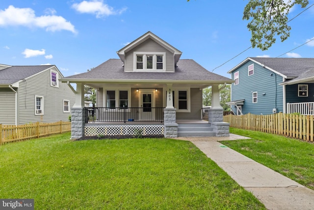 bungalow-style home featuring a porch and roof with shingles