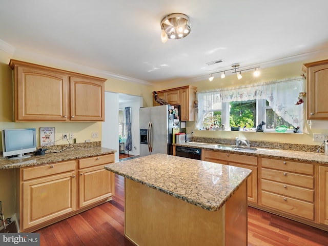 kitchen featuring stainless steel refrigerator with ice dispenser, a sink, black dishwasher, a kitchen island, and wood finished floors