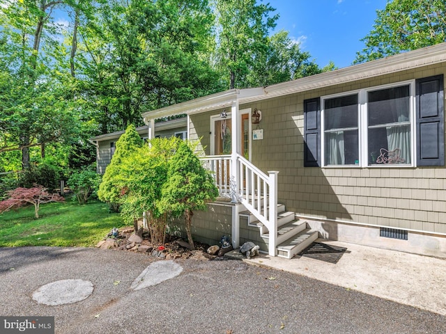 doorway to property featuring crawl space