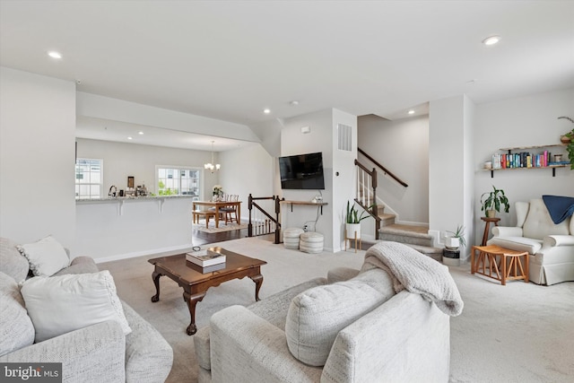 living area featuring carpet flooring, recessed lighting, stairs, baseboards, and a chandelier