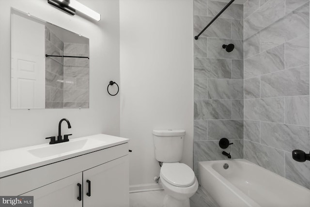bathroom with vanity, toilet, shower / washtub combination, marble look tile flooring, and baseboards