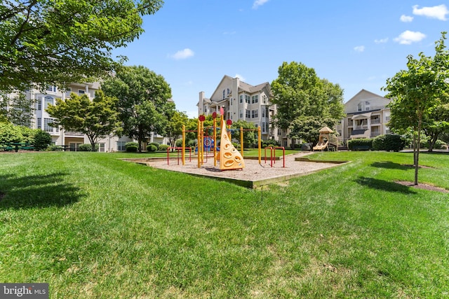 communal playground featuring a yard