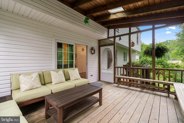 wooden deck with an outdoor living space