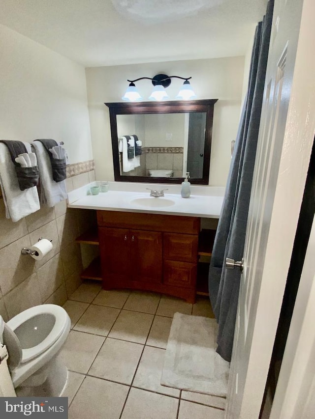 2624 Redcoat Dr Unit 2B, Alexandria, VA 22303 - bathroom featuring tile patterned floors, vanity, toilet, and tile walls