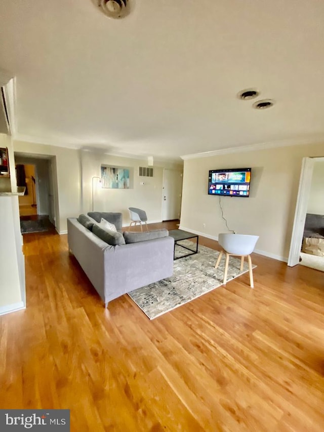 2624 Redcoat Dr Unit 2B, Alexandria, VA 22303 - living area with crown molding, wood finished floors, and baseboards