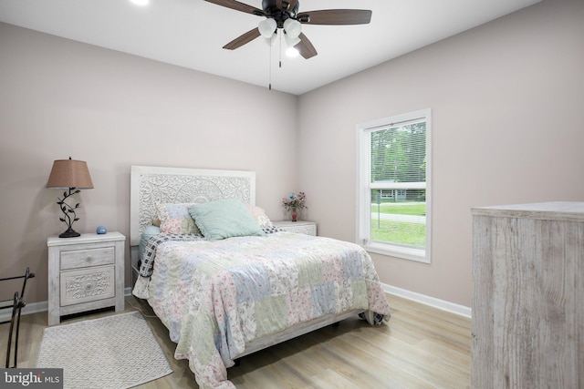 309 N Glebe Rd, Montross, VA 22520 - bedroom featuring baseboards, wood finished floors, and a ceiling fan