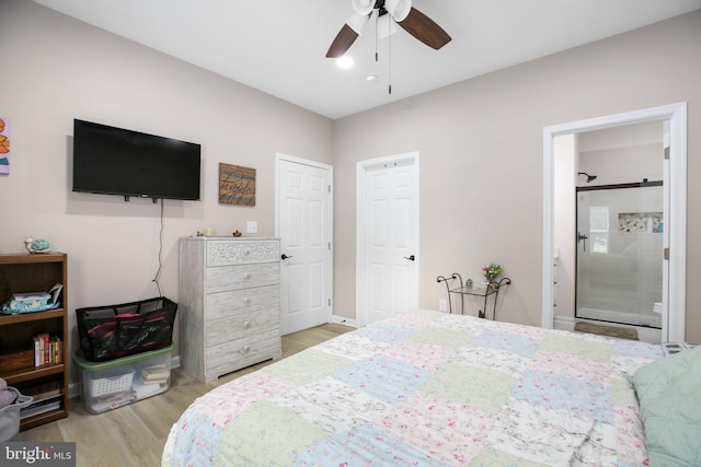 309 N Glebe Rd, Montross, VA 22520 - bedroom featuring wood finished floors, ceiling fan, and ensuite bathroom
